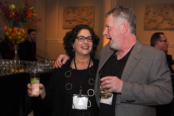 Lisa Schroeder, latke-lover, chef and owner of Mother's Bistro & Bar enjoy a friendly moment with hamantaschen-fan and debate competitor, Ken Gordon, owner of Kenny & Zukes's. Saturday's event, The Great Latke-Hamantaschen Debate at The Cleaners at the Ace Hotel ended in hilarity . . . and a draw.