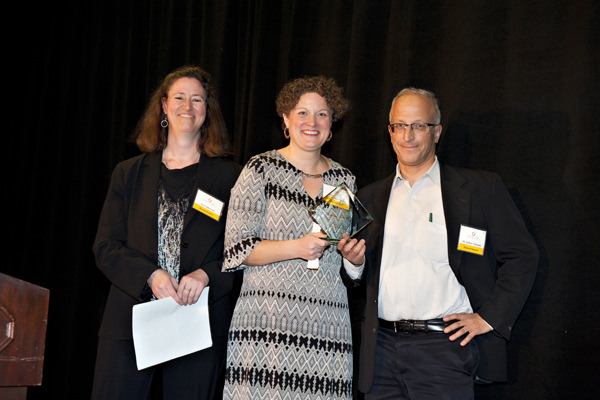  Sia Lindstrom and Linda Nilsen-Solares of Project Access NOW awarding Dr. Jeffrey Menashe of Compass Oncology for their commitment to caring for the under-served.