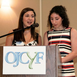 Event Chairs, Danielle Spring (left) and Maayan Agam (right) welcome guests to the OJCYF 10th Anniversary Celebration Benefit Dinner.