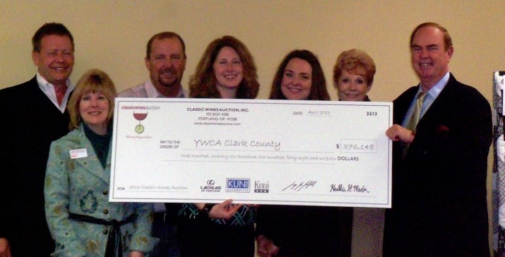 The Classic Wines Auction presents YWCA Clark County with $376,148 raised from its gala annual auction. Pictured left to right: Paul Vogel, Classic Wines Auction board member; Shawna Burkholder, YWCA Clark County director of development and communications; Kevin Weaver, YWCA Clark County board vice president of fund development; Sherri Bennett, YWCA Clark County executive director; Megan Vaughn, YWCA Clark County board president; Karen Hinsdale, Classic Wines Auction board member; Keith Barnes, Classic Wines Auction board member.