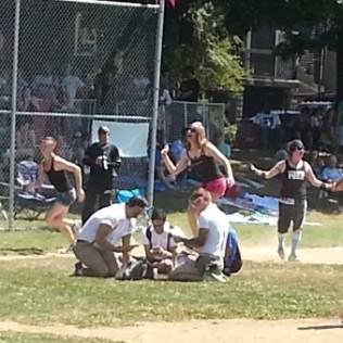 The Gay Nerds started reading in the infield during the game between the Barbies and the Biker Chicks.