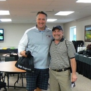 Patrick McCreery, KPTV/KPDX General Manager and Larry Adoff, KPTV/KPDX Research Director gear up for tee time.