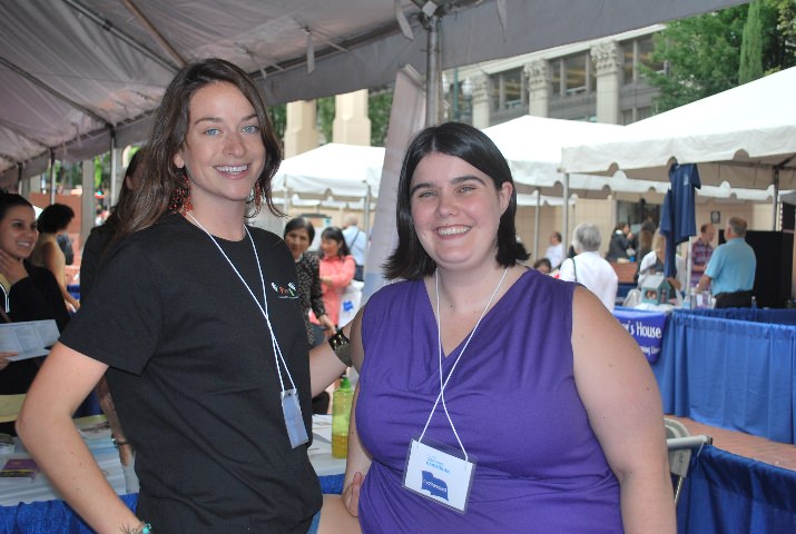 Grace Stainback and Katie Farewell told visitors to their booth about PHAME Academy programs.