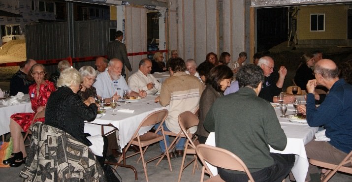 Donors and Neighborhood House staff celebrating together in the Opportunity Center site.