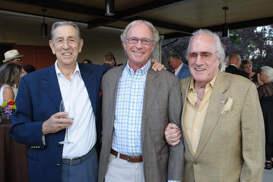 Longtime friends Milt Lampros, Bill Furman, and Howard Hedinger enjoy the Community Center garden patio.