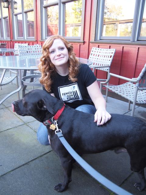 Amanda, a long-time Fences For Fido volunteer, loving on tri-pod Tryke, a formerly chained dog who was surrendered to Fences For Fido many months ago.