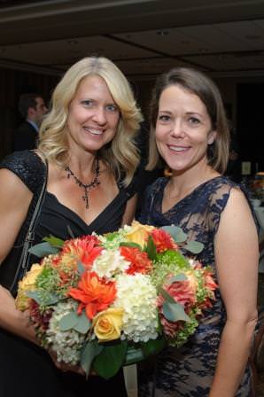 Heather Mansberger and Dr. Emily Jones with flowers donated by Zupan’s Market