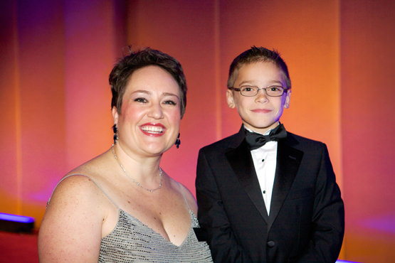 Make-A-Wish Oregon CEO Laila Cook with wish kid Cason, who wished to meet a wolverine in Alaska.