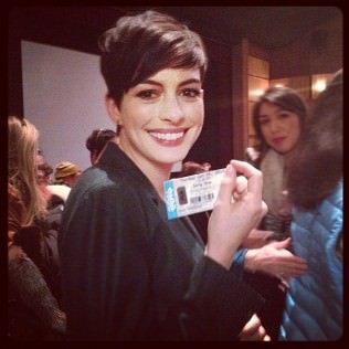 Anne Hathaway holds a ticket to her film "Song One".