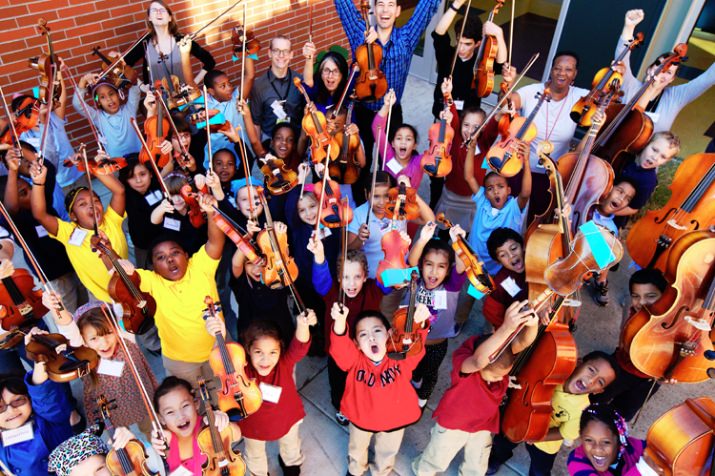 The big group photo is our BRAVO Rosa Parks After-school Orchestra and Chorus, plus some staff and community volunteers. These forty students meet every day after school for two hours of choral singing, stringed instrument practice, and orchestra rehearsal.