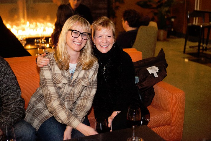 Filmgoers enjoy the warmth of the fireplace at OMSI's Theory Eatery on opening night.