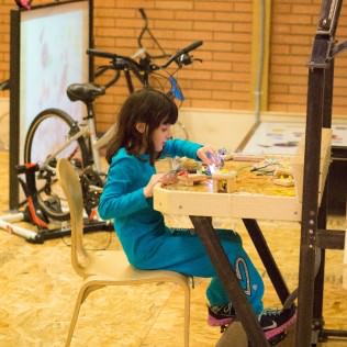 Light up an electrical tower and create circuits through stationary bikes at "Pedal Power."