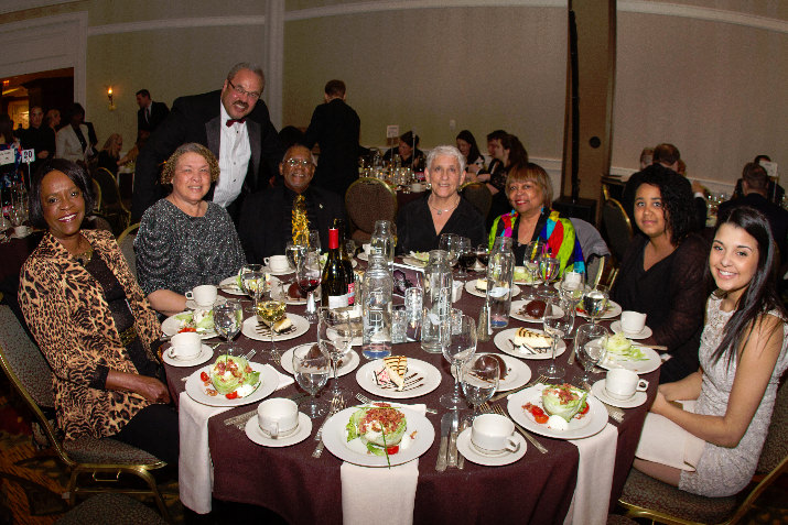 Gala Sponsor Brooks Staffing CEO Sam Brooks (with the gold tie) and EVP Margaret Brooks (to his left) with their guests