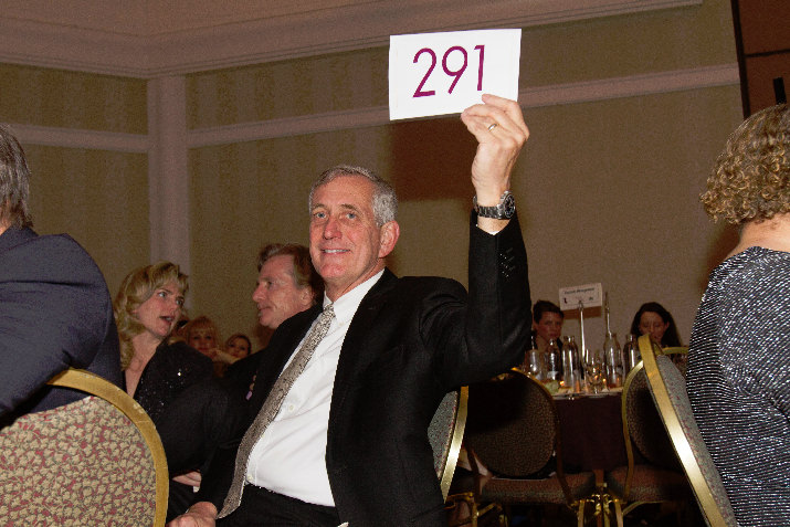 Mayor Charlie Hales shows his generosity, raising his bid card during the gala’s special appeal