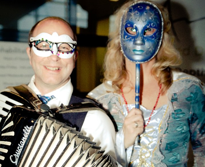 Accordian player and Cathy Newman, Head of School, Sunstone Montessori School 