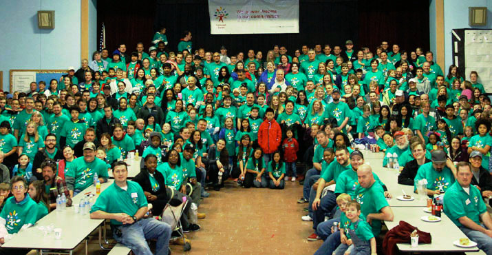 More than 300 Comcast Cares Day volunteers clean, paint, and spruce up the grounds of Parklane and Oliver elementary schools. Photo by Scott Cloud.