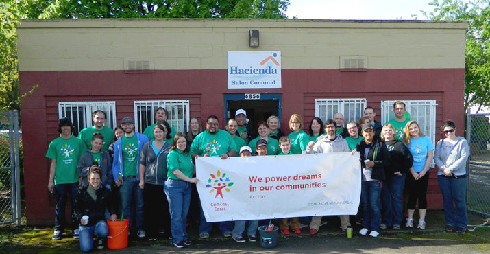 Comcast and community volunteers painted and cleaned Hacienda CDC's Salon Communal. Volunteers also worked at the Los Jardines de la Paz building. Photo by Bernard Lorenzo.