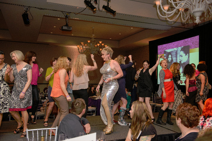 Dancing on the catwalk with jubilant guests and Bradley Angle staff members at the close of the successful evening. 