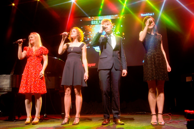 The Von Trapps harmonize…minutes before children jump on stage to dance with them!