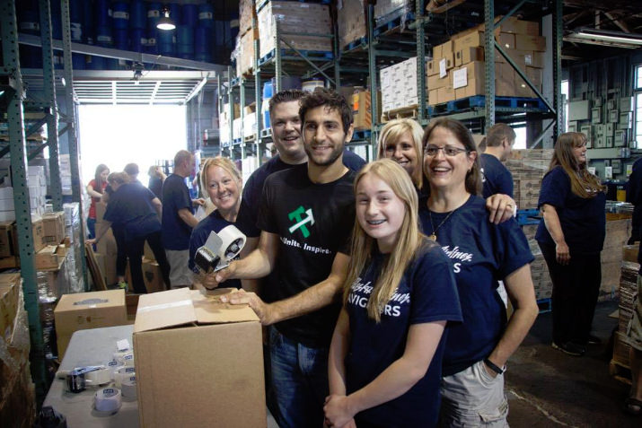 Diego Valeri and Alaska Airlines help clean and pack food for local families at Portland Police Bureau Sunshine Division during Stand Together Week. Photo, Meg Williams-Portland Timbers
