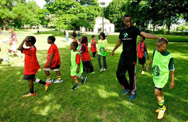 June 19, 2014, Portland, OR, USA. Steve Zakuani and the 4 Worlds United Soccer Alliance play soccer with refugee kids at Powell Park. Photo, Craig Mitchelldyer-Portland Timbers