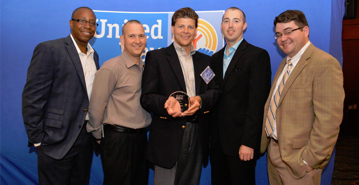 Shawn Butler, Operations Manager, UPS; Lyle Arnett, Operations Manager, UPS; Kevin Church, Division Manager, UPS; Wes Walker, Operations Manager, UPS; Adam Crawford, Corporate Relations Executive, United Way of the Columbia-Willamette.  Church won the Employee Campaign Coordinator of the Year award. 
