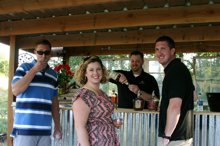 Ben Ives, Sara Delepine and Brian Huck enjoy the whiskey tasting bar.