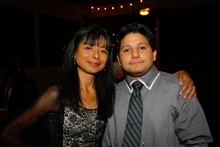 Jilma Meneses, Latino Network Board Chair and Chief Diversity Officer at Portland State University, poses with Jason Franco, a Latino Network program participant. Jason spoke at the event, sharing how Latino Network changed his life for the better.  Photo Credit: Izzy Ventura 