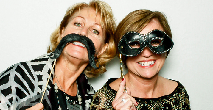 Noma Hanlon and Gail Snow have fun in the photo booth