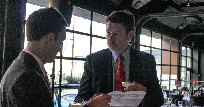 Head of School, Blake Peters and German Consul General, Stefan Schlüter enjoy appetizers and a Prohibition cocktail during Happy Hour. 