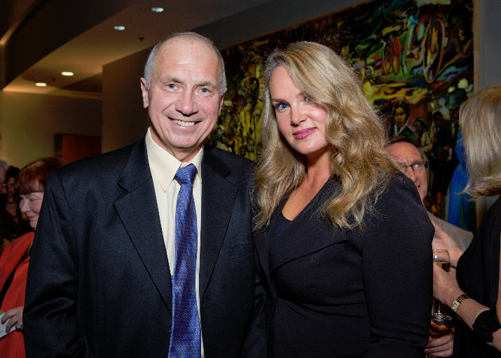 Bank of America ​Senior ​Vice President Monique Barton and her father Bill Barton, a strong supporter of Portland State University, pause for a photo during the pre-dinner reception.