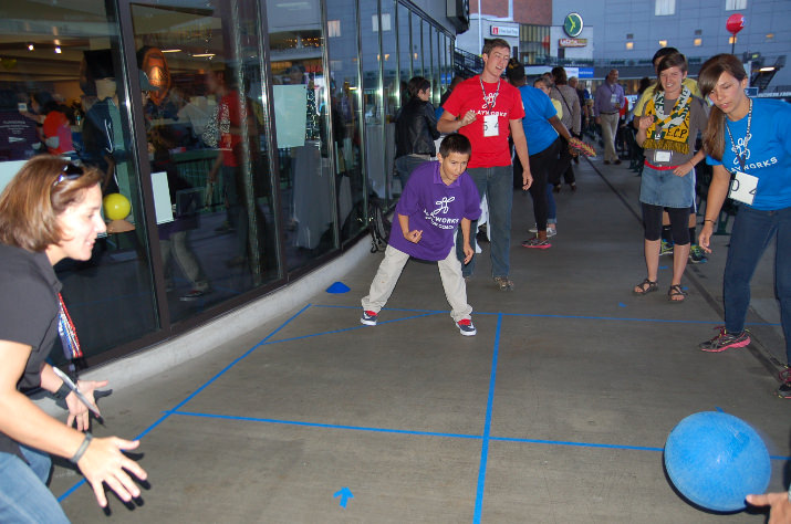 Guest play some 4-square on the patio with Junior Coach Desmond Garza. 