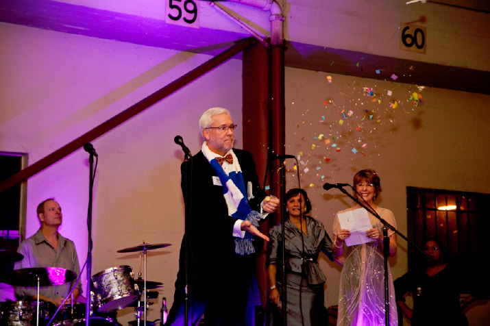 Kent Roberts, St. Mary's Academy's chair of the board of directors, releases celebratory confetti.