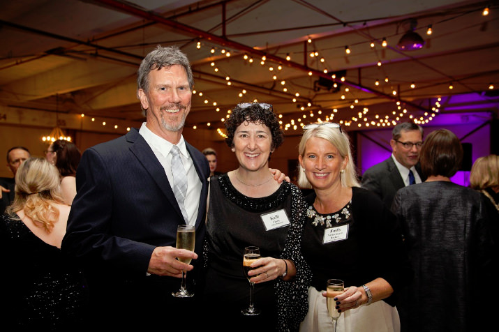 Steve Kucas, St. Mary’s Academy Principal Kelli Clark and Emily Niedermeyer Becker, St. Mary’s Academy VP for Development, toast to the school's future.