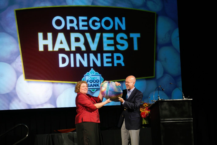 Susannah-Ford Award - Oregon Food Bank CEO Susannah Morgan presents the Donor of the Year award to Ford Motor Company Fund. Larry Gregerson accepted on behalf of the company.