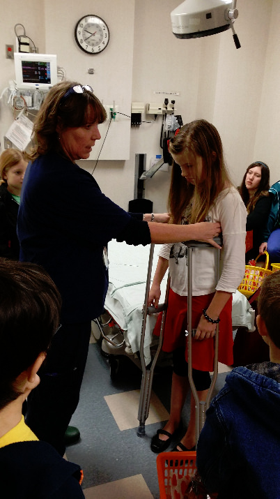 Donna Mairose teaching Abby Mowery about crutches.