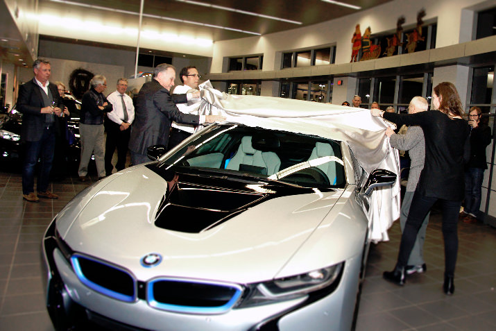 With nearly 75 guests cheering him on, Hermann unveiled the luxury hybrid sports car with the help of his father and daughter. 