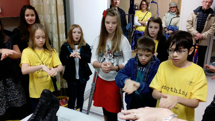 The kids learning how to correctly wash hands.