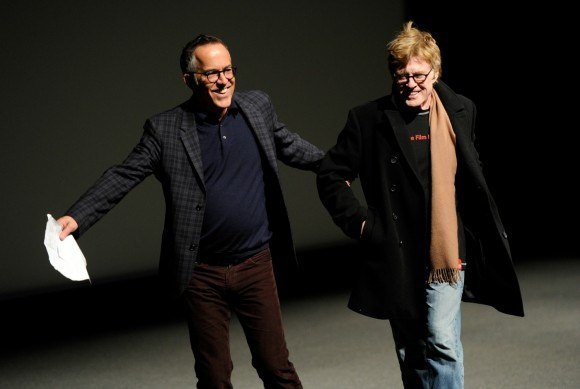 John Cooper, left, director of programming for the Sundance Film Festival, leads Robert Redford, founder of the Sundance Institute, to the podium before the premiere of the documentary film "What Happened, Miss Simone?," on the opening night of the 2015 Sundance Film Festival on Thursday, Jan. 22, 2015, in Park City, Utah.