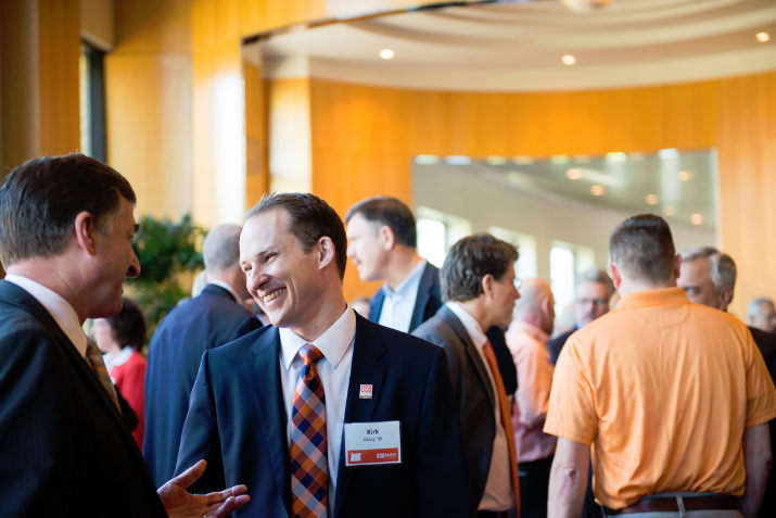 Steve Clark, Vice President for University Relations & Marketing, chats with Kirk Maag '05. — with Kirk Maag at Oregon Convention Center.