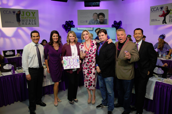 From left: Fox 12 Oregon’s Wayne Garcia, Amy Troy, and Shauna Parsons, 105.1 The BUZZ’s Daria, Mitch, and Ted, and FOX 12 Oregon’s Mark Nelson, proudly display the total at the close of the Valentine-A-Thon.