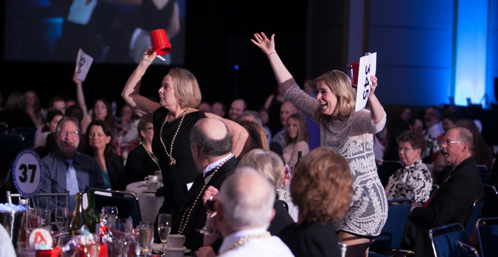 Claudia and Molly McClure had fun capturing the auctioneer’s attention.