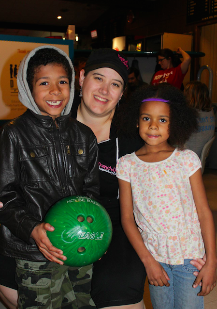 Dreamers Thadeus and Lidia, with mom Daphne, bowled strikes at the family-friendly portion of the event