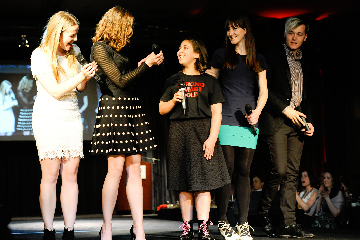 Girls Inc. girl, Rowan, sings with the von Trapps (2015 Purse-o-nalities) on the runway. 
