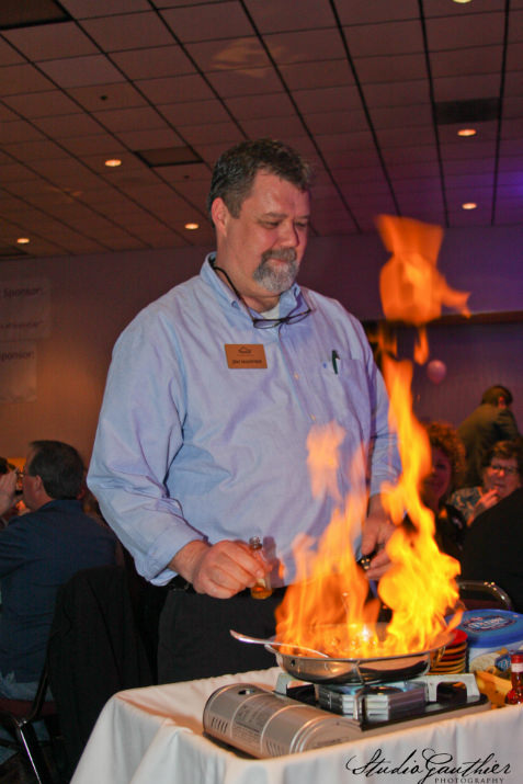  The flames were as high as the auction bidding thanks to SnowCap board vice-chair Jim Mahnke’s mastery of the bananas foster. This dessert dash prize served by Goldie Hohnstein (not shown) at SnowCap’s auction held March 14.