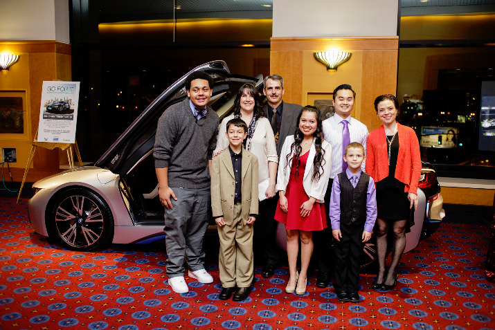 Speakers representing Classic Wines Auction charity partners, Metropolitan Family Service (MFS), New Avenues for Youth, Friends of the Children, YWCA Clark County and Randall Children’s Hospital at Legacy Emanuel pose in front of the BMW i8 before taking the stage