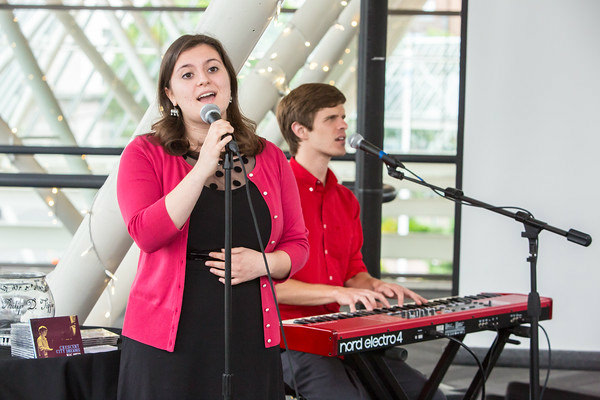 YMA Alum Carly Lewis and Mac Potts perform songs in celebration.