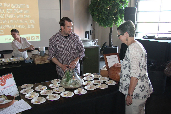 Laurelhurst Market Chef Ben Bettinger serves up an aromatic beef broth with beef tongue, smoked bone marrow, pickled egg and summer vegetables at Corks + Forks.