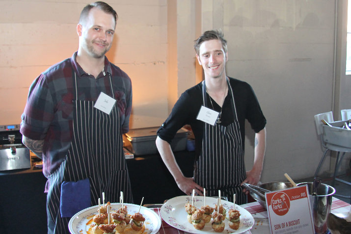 Jake and Chris of Son of a Biscuit dish out mini biscuits and Nashville-style spicy chicken skewers at the 2nd Annual Corks + Forks event at Castaway Portland.