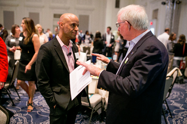 Michael Thomas, Sanctuary consultant for Morrison Child & Family Services, and Al Jubitz, Morrison Board of Director Emeritus, sharing notes before the Luncheon